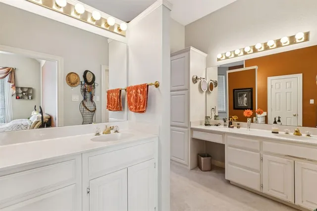 a bathroom with a sink vanity and mirror