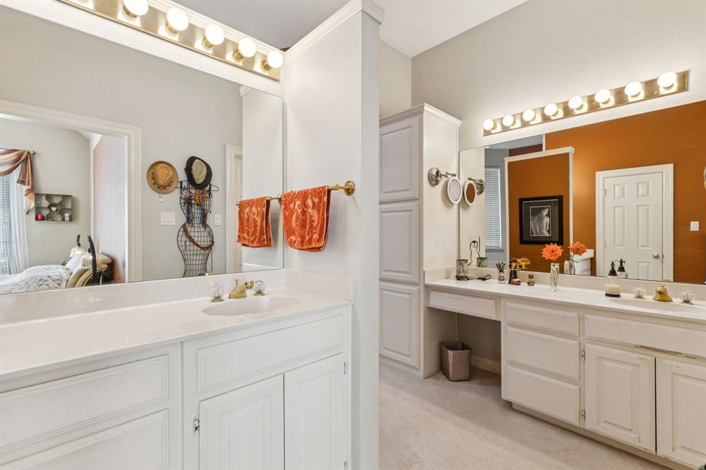 3825 Montecito Drive Denton, TX 76205 - Photo 21 of 37 a bathroom with a sink vanity and mirror