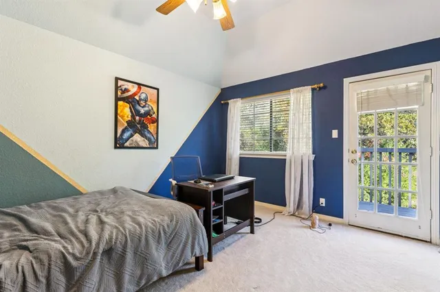 a bedroom with bed and a window