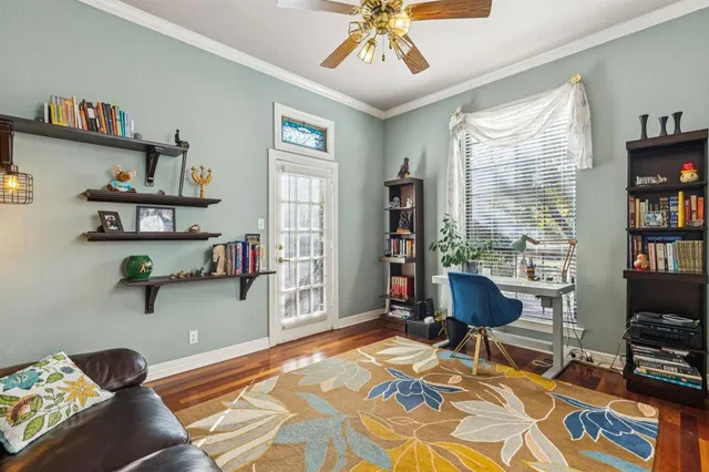 a bedroom with furniture and a book shelf