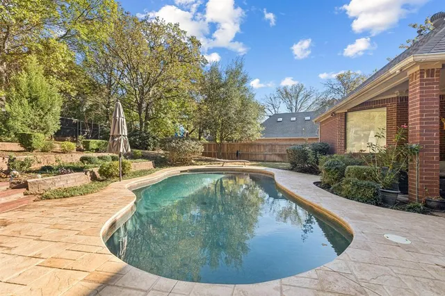 a view of a swimming pool with an outdoor seating
