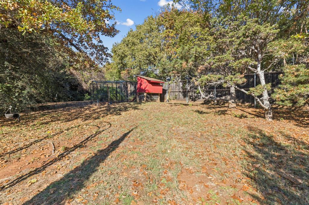 3825 Montecito Drive Denton, TX 76205 - Photo 35 of 37 a view of a yard with trees