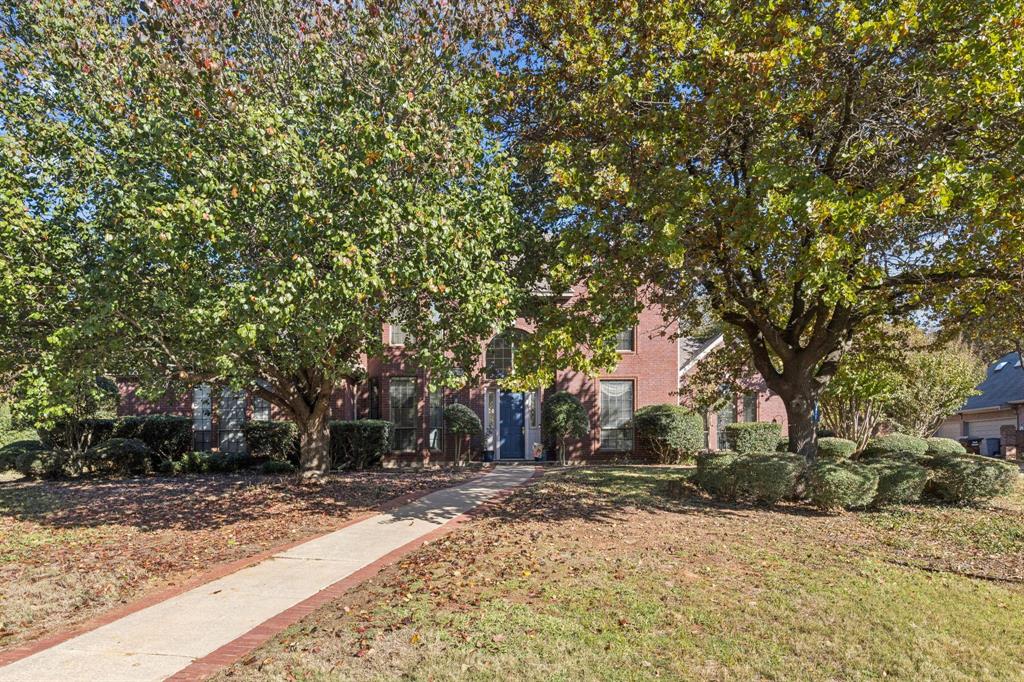 3825 Montecito Drive Denton, TX 76205 - Photo 4 of 37 a backyard of a house with trees
