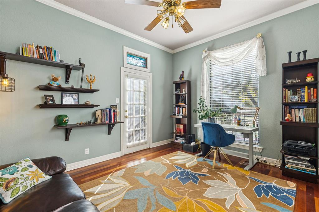 3825 Montecito Drive Denton, TX 76205 - Photo 5 of 37 a bedroom with furniture and a book shelf