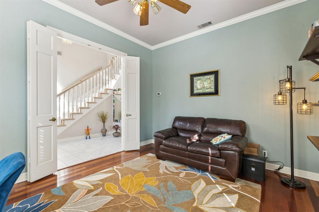 3825 Montecito Drive Denton, TX 76205 - Photo 6 of 37 a living room with furniture and a rug