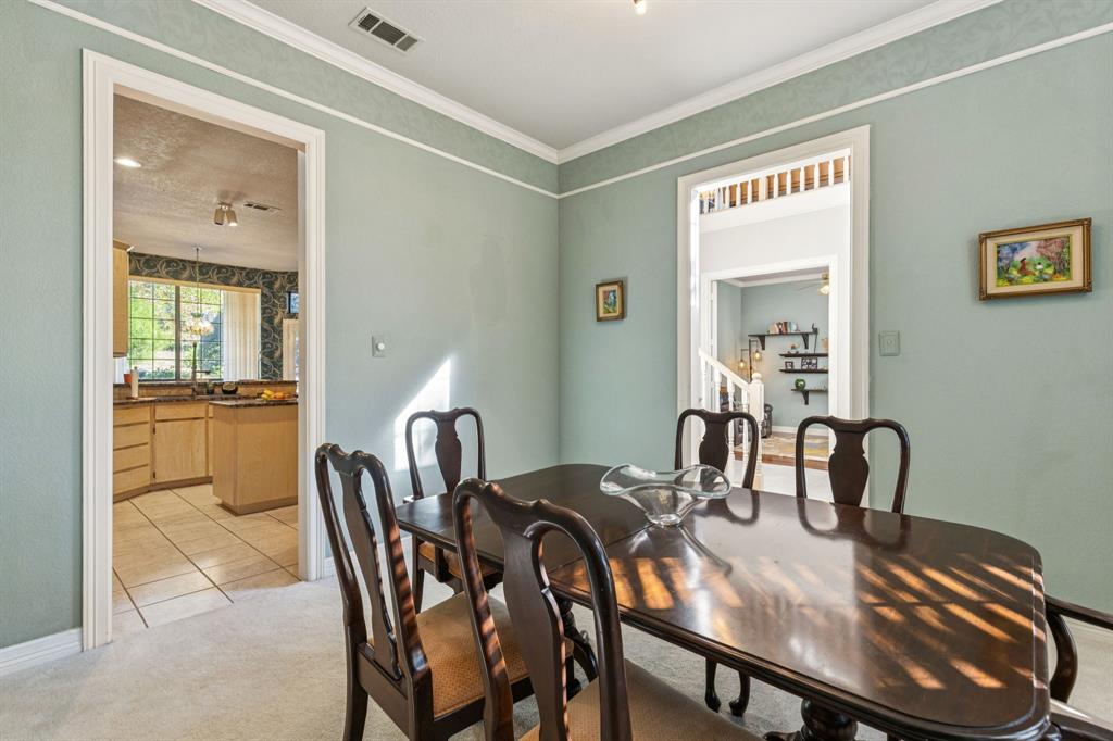 3825 Montecito Drive Denton, TX 76205 - Photo 9 of 37 a view of a dining room with furniture and bathroom