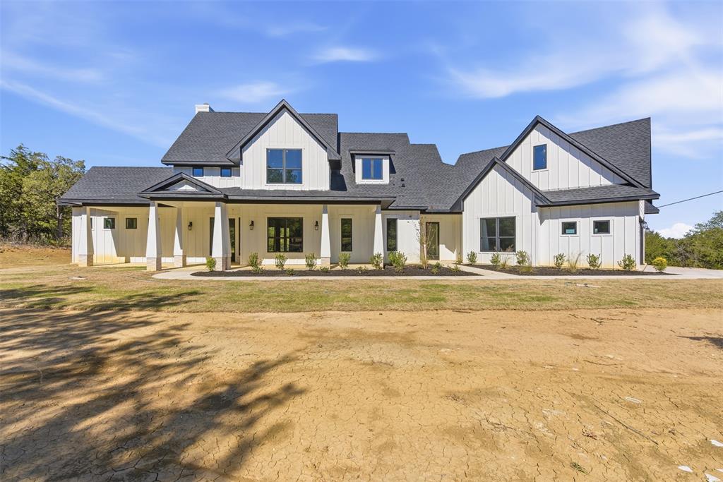 1552 Lakeridge Boulevard Sunset, TX 76270 - Photo 8 of 33 a house with a swimming pool in front of it