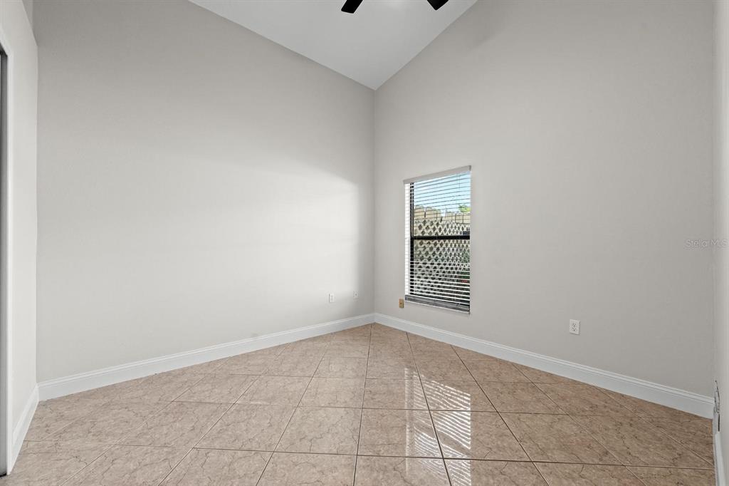 9147 Duffer Court Hudson, FL 34667 - Photo 8 of 15 an empty room with windows