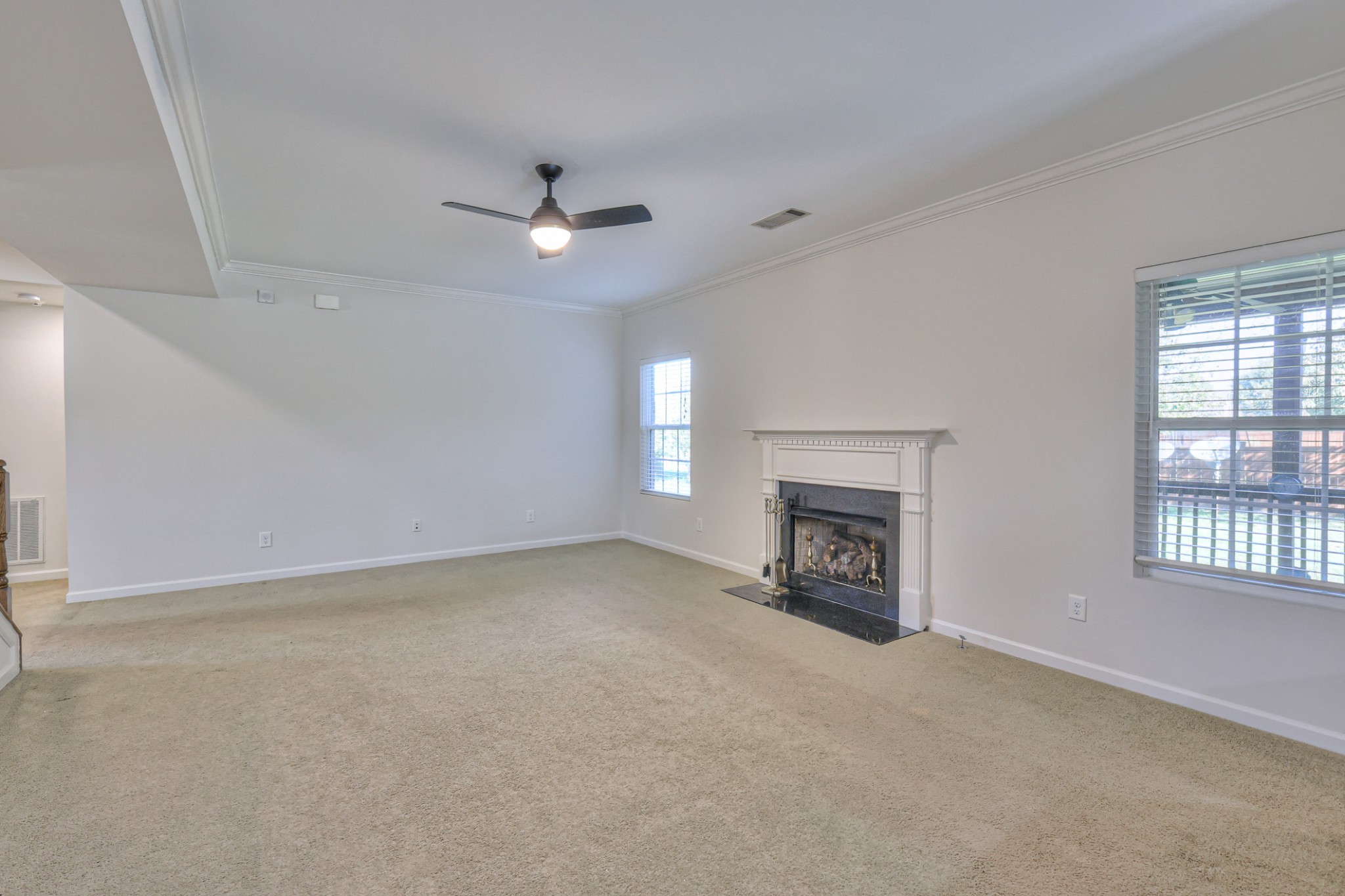 3104 Rutgers Pass Nolensville, TN 37135 - Photo 16 of 66 a view of an empty room with a fireplace and a window