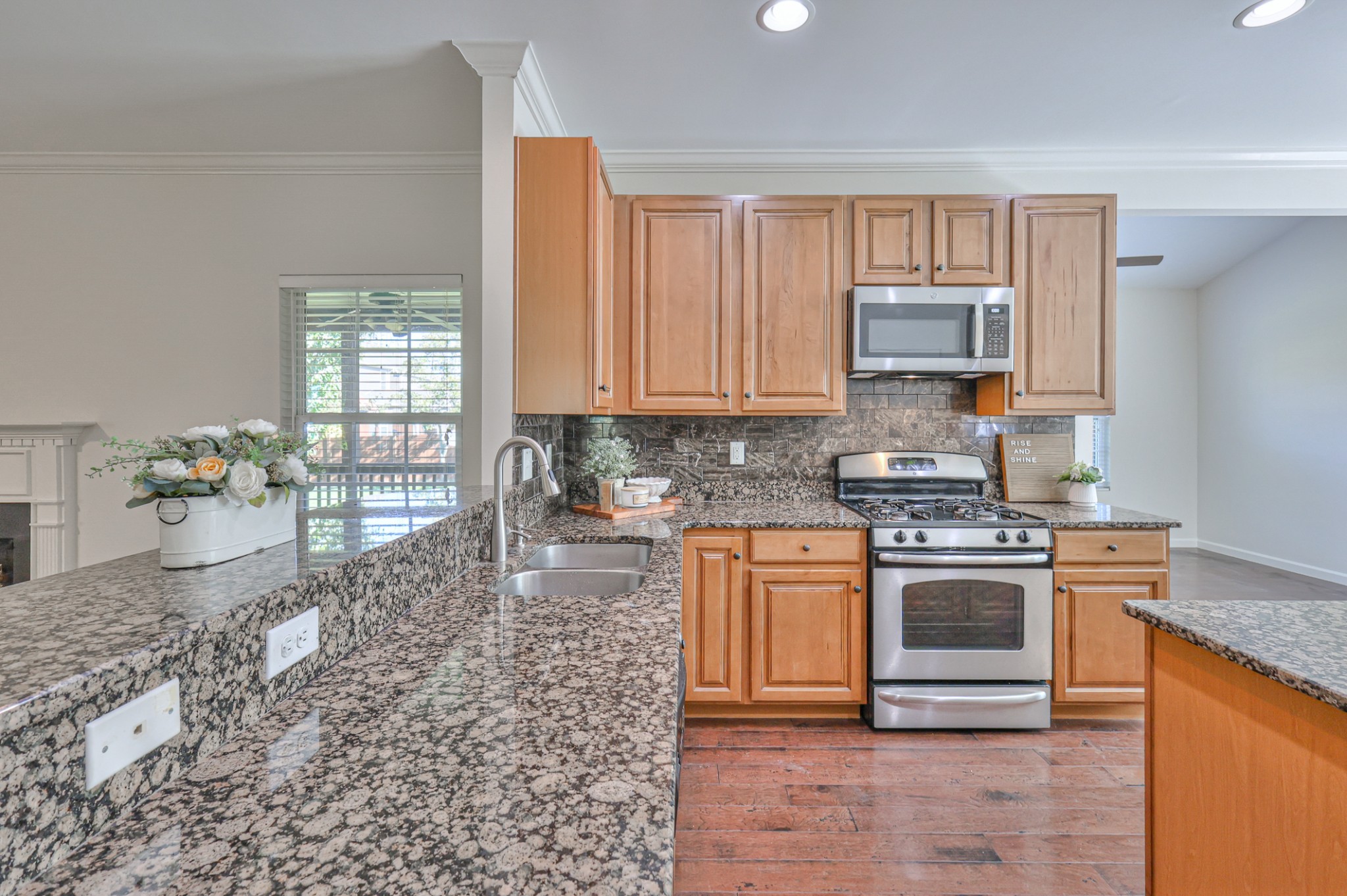 3104 Rutgers Pass Nolensville, TN 37135 - Photo 19 of 66 a kitchen with stainless steel appliances granite countertop a stove a sink and a microwave