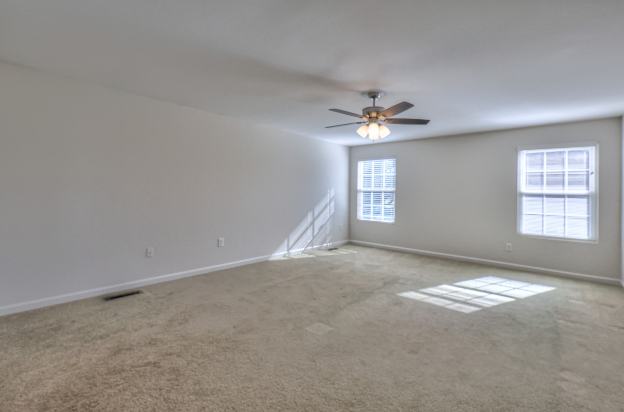 3104 Rutgers Pass Nolensville, TN 37135 - Photo 34 of 66 an empty room with windows and ceiling fan
