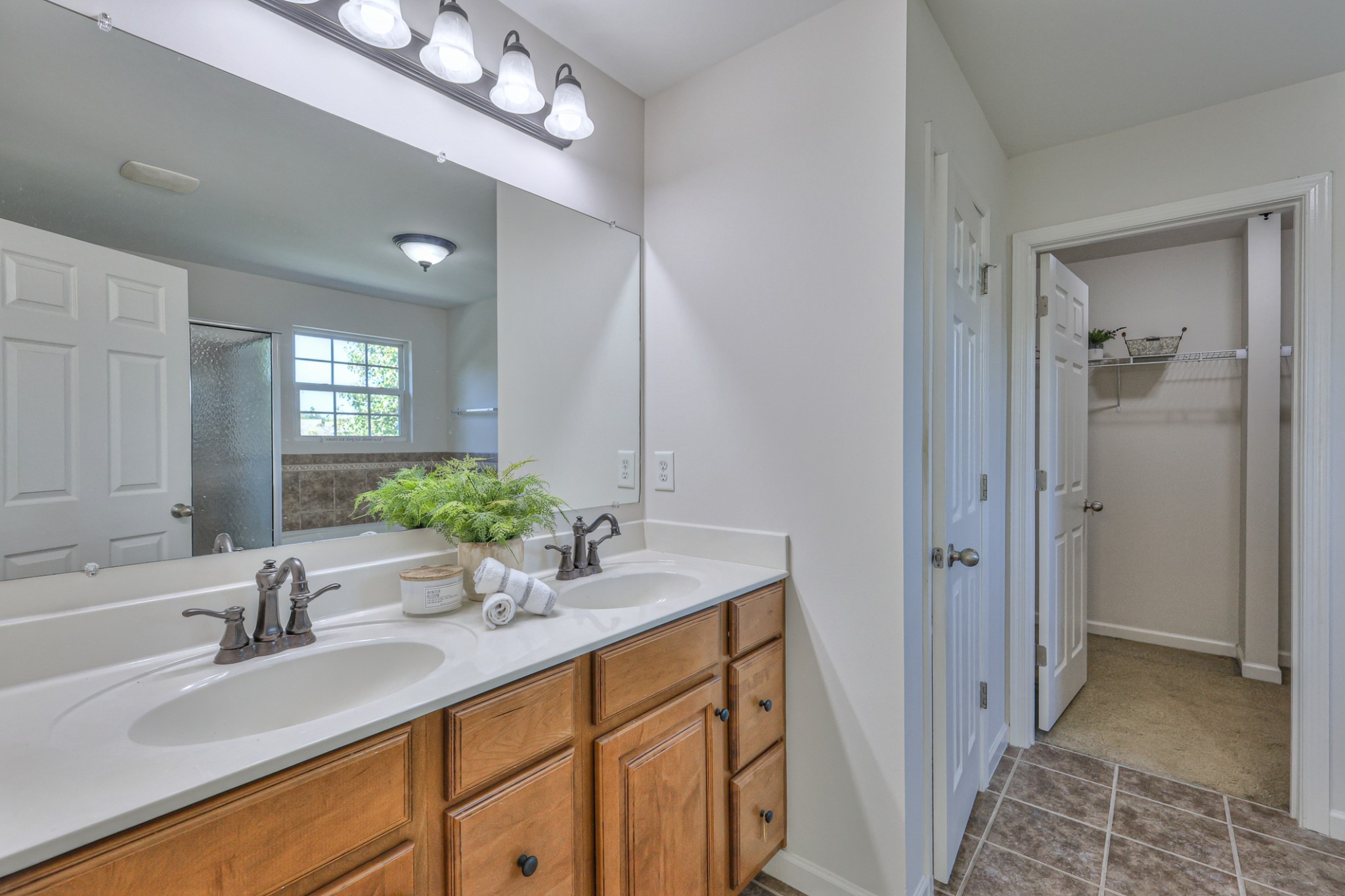 3104 Rutgers Pass Nolensville, TN 37135 - Photo 36 of 66 a bathroom with a sink double vanity and a mirror