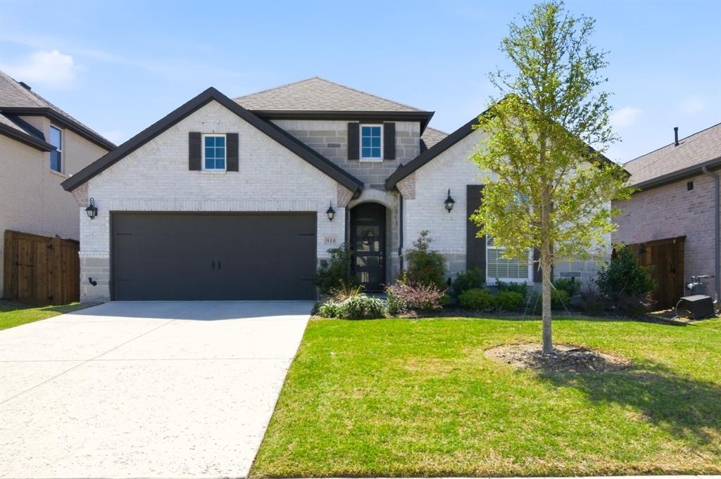 910 Winter Cherry Lane Haslet, TX 76052 - Photo 1 of 40 a front view of a house with a yard and garage