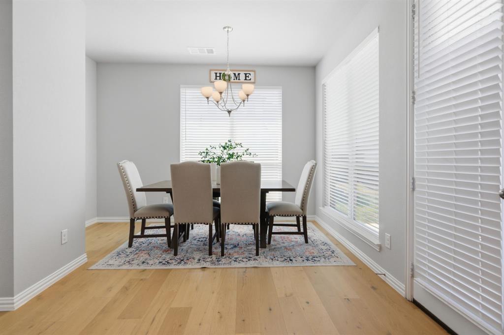 910 Winter Cherry Lane Haslet, TX 76052 - Photo 17 of 40 a view of a dining room with furniture