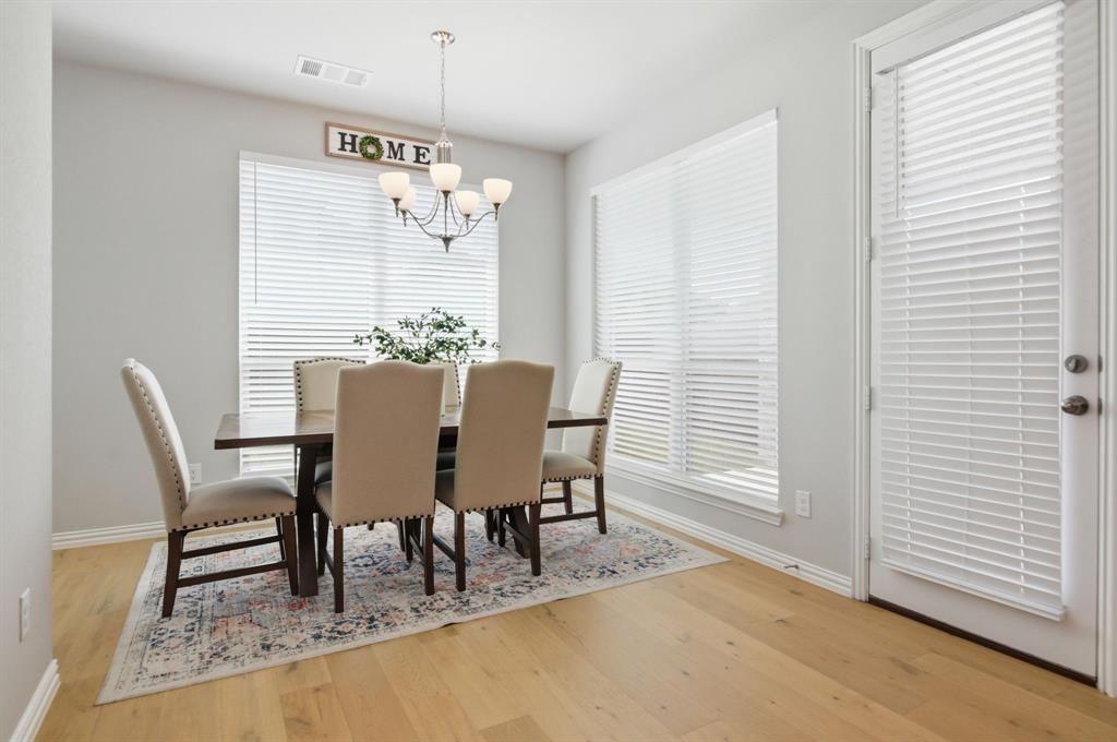910 Winter Cherry Lane Haslet, TX 76052 - Photo 18 of 40 a dining room with furniture and window