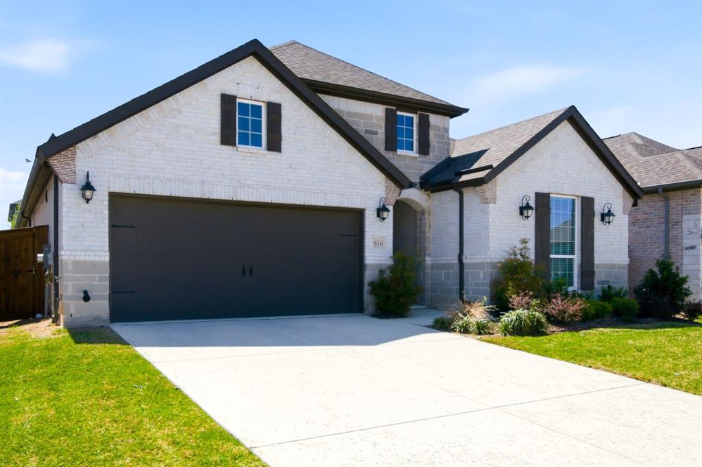 910 Winter Cherry Lane Haslet, TX 76052 - Photo 2 of 40 a front view of a house with a yard and garage