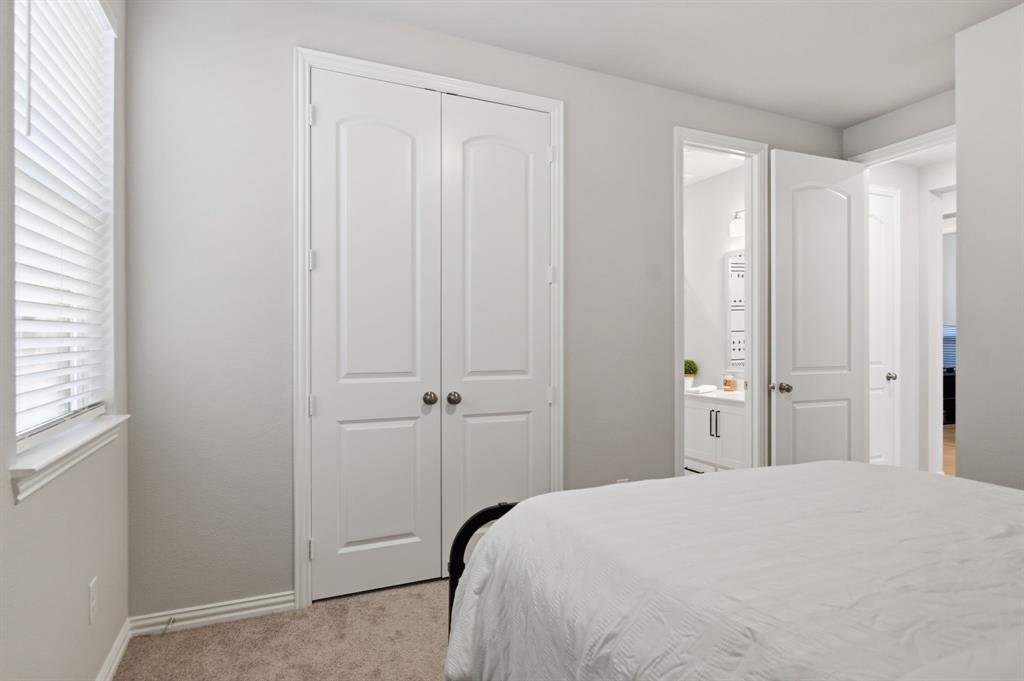 910 Winter Cherry Lane Haslet, TX 76052 - Photo 25 of 40 a bedroom with a bed and a window