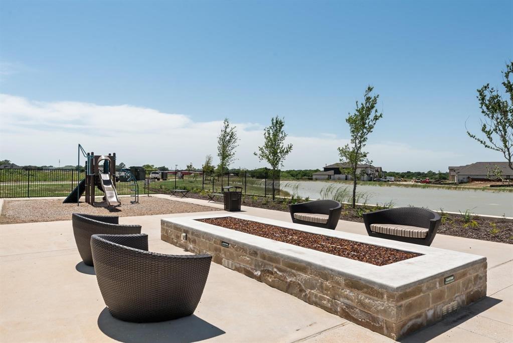 910 Winter Cherry Lane Haslet, TX 76052 - Photo 39 of 40 a view of a swimming pool with lounge chairs