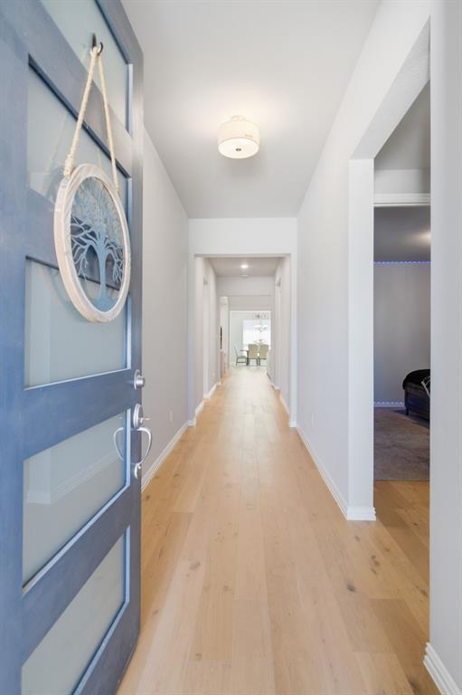 910 Winter Cherry Lane Haslet, TX 76052 - Photo 4 of 40 a view of a hallway with bathroom