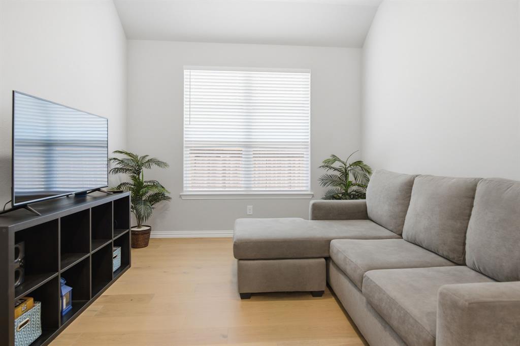910 Winter Cherry Lane Haslet, TX 76052 - Photo 6 of 40 a living room with furniture and a window