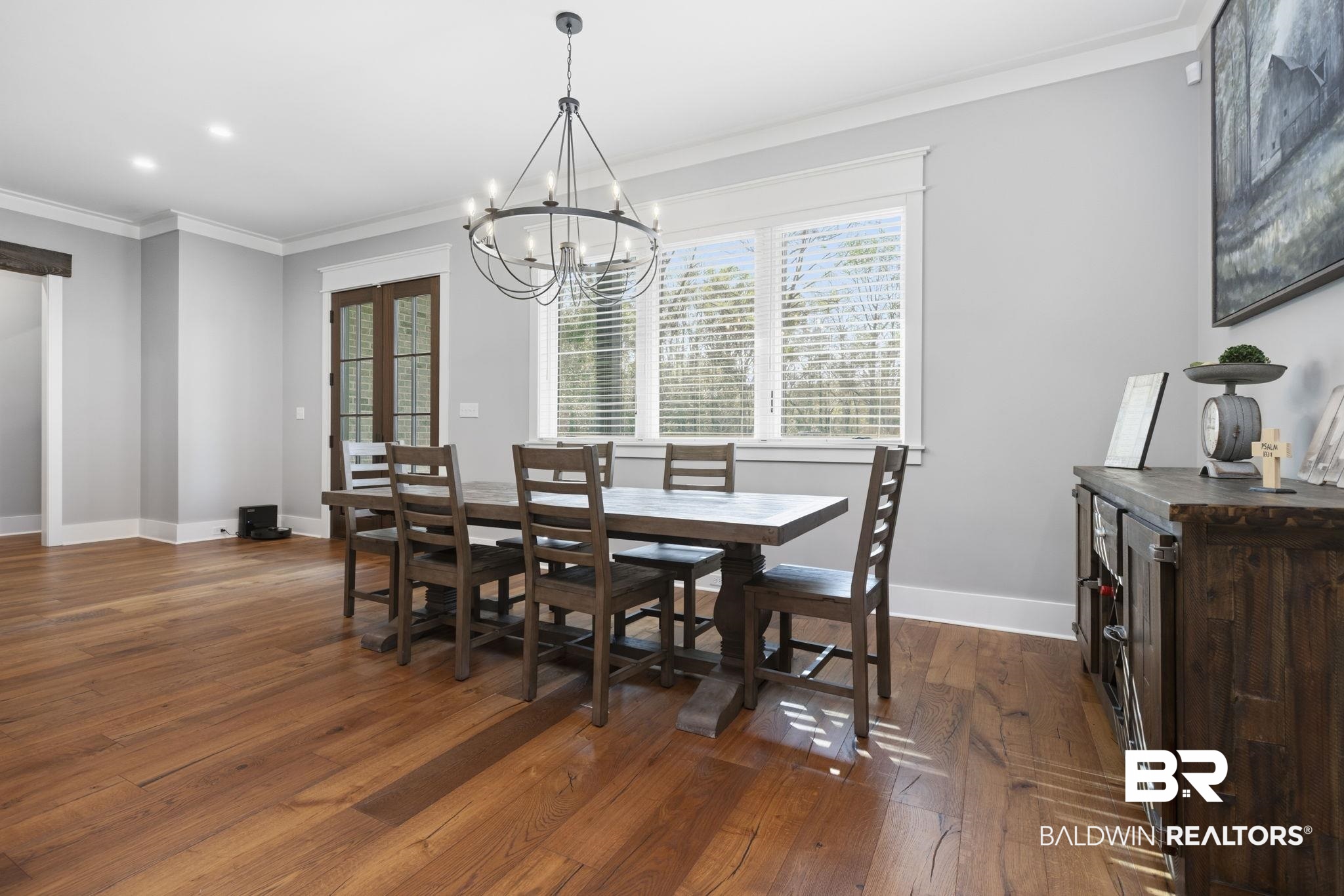 9501 Ben Hamilton Road Theodore, AL 36582 - Photo 15 of 69 Dining space with dark wood-style floors, crown molding, and hanging lights
