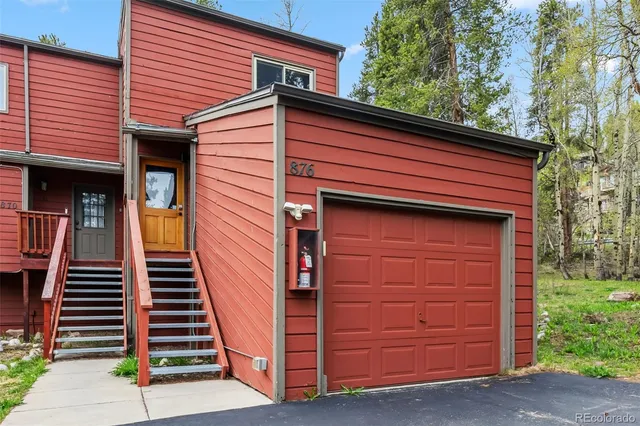 a front view of a house with stairs