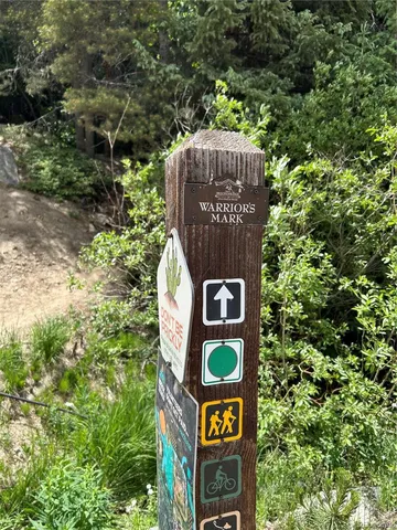 a toilet sitting in a bathroom next to a blue wall