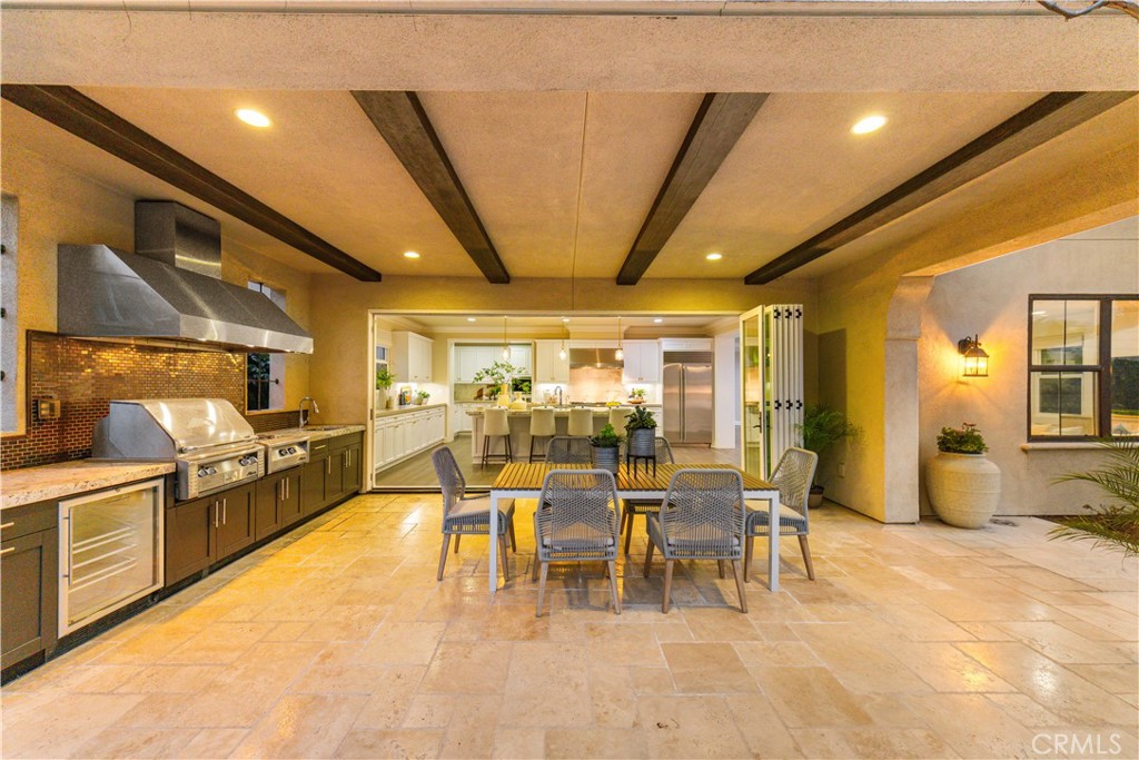 71 Clocktower Irvine, CA 92620 - Photo 49 of 59 Covered California room with a fully equipped built-in outdoor kitchen