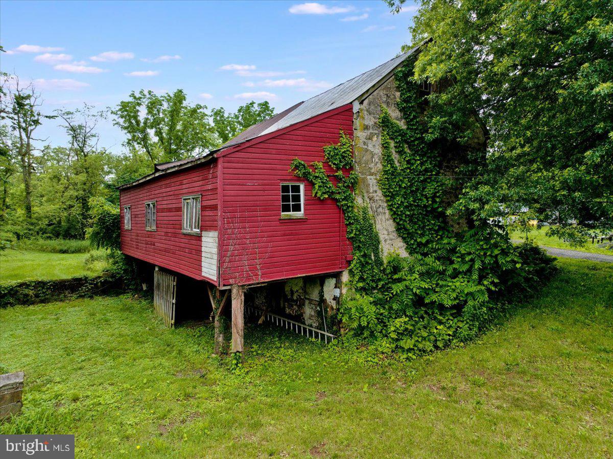 3854-3856 Schuylkill Road Spring City, PA 19475 - Photo 13 of 22 a view of a backyard with plants and a garden