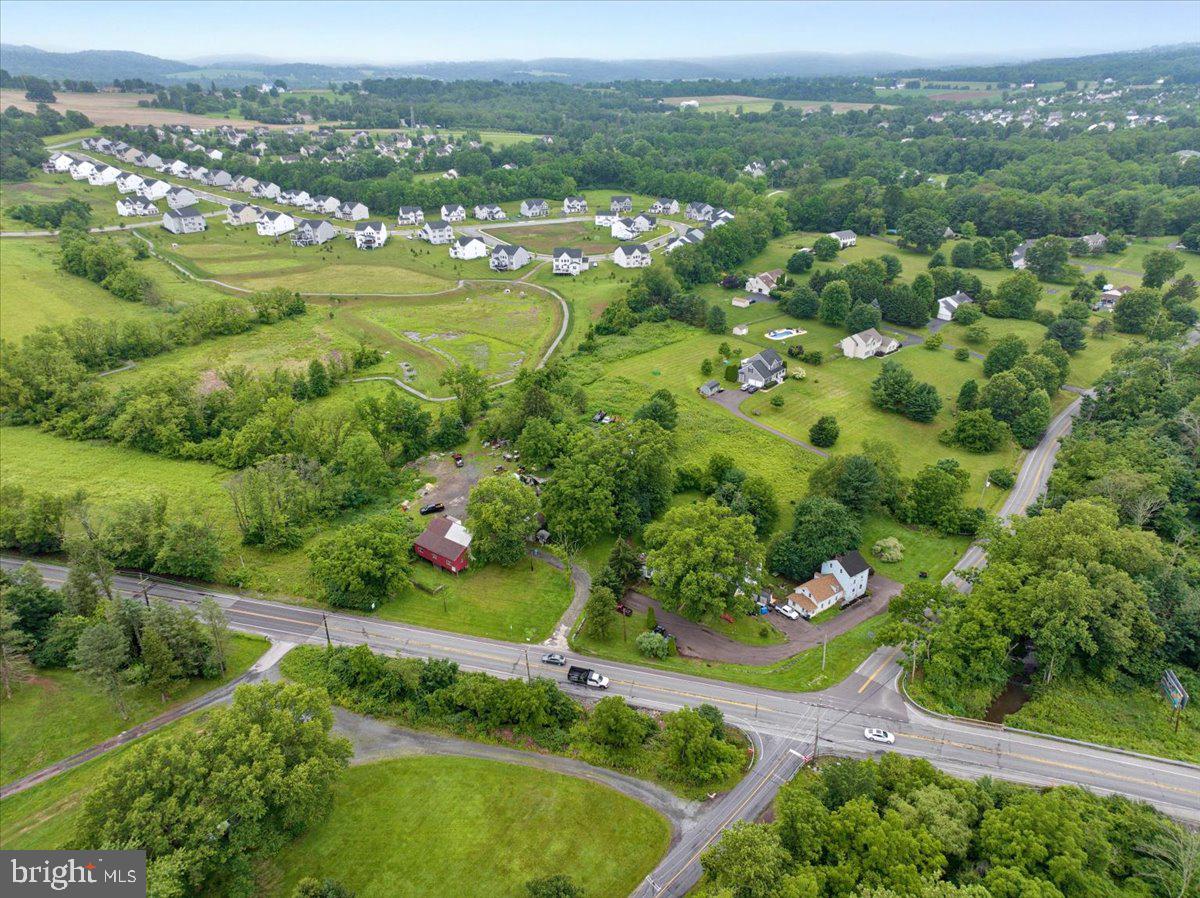 3854-3856 Schuylkill Road Spring City, PA 19475 - Photo 21 of 22 an aerial view of green landscape with trees houses and mountain view