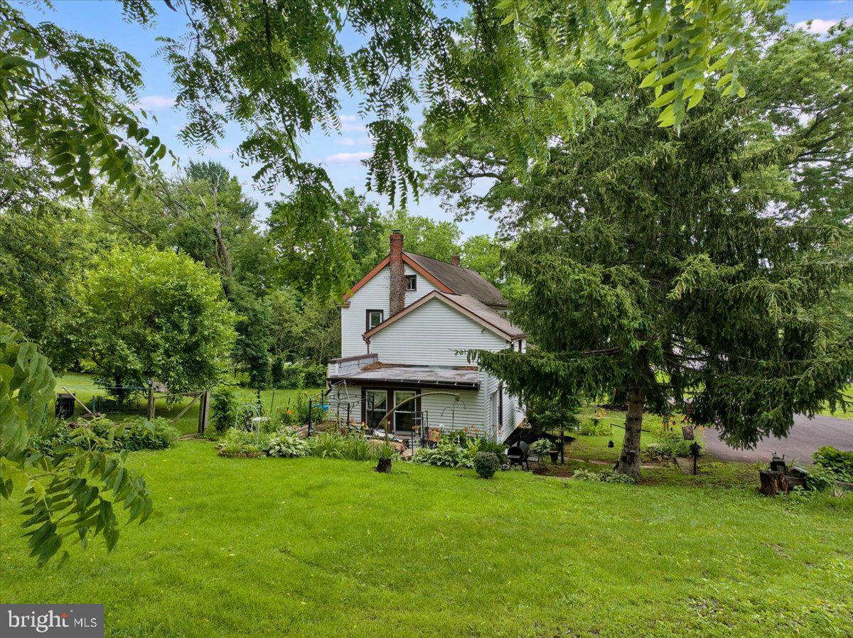 3854-3856 Schuylkill Road Spring City, PA 19475 - Photo 8 of 22 a front view of a house with a garden