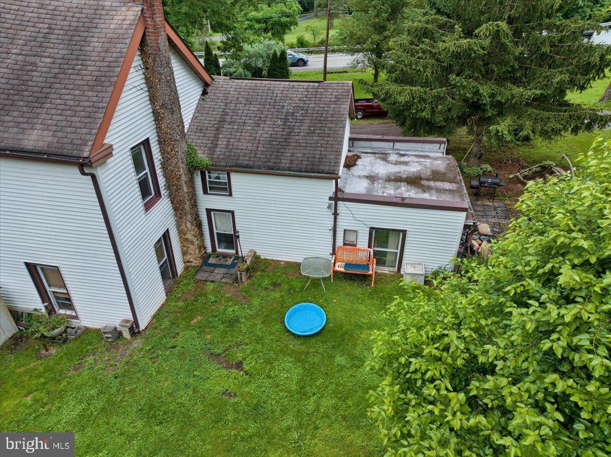 3854-3856 Schuylkill Road Spring City, PA 19475 - Photo 10 of 22 a view of a backyard with table and chairs