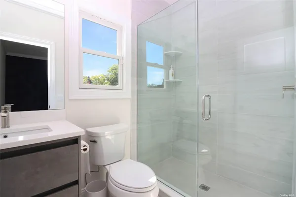 an aerial view of a house with garden space and street view