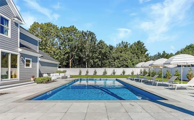 a view of a swimming pool with a patio
