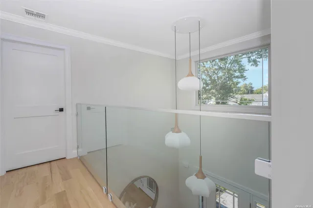 a bathroom with a window and a shower