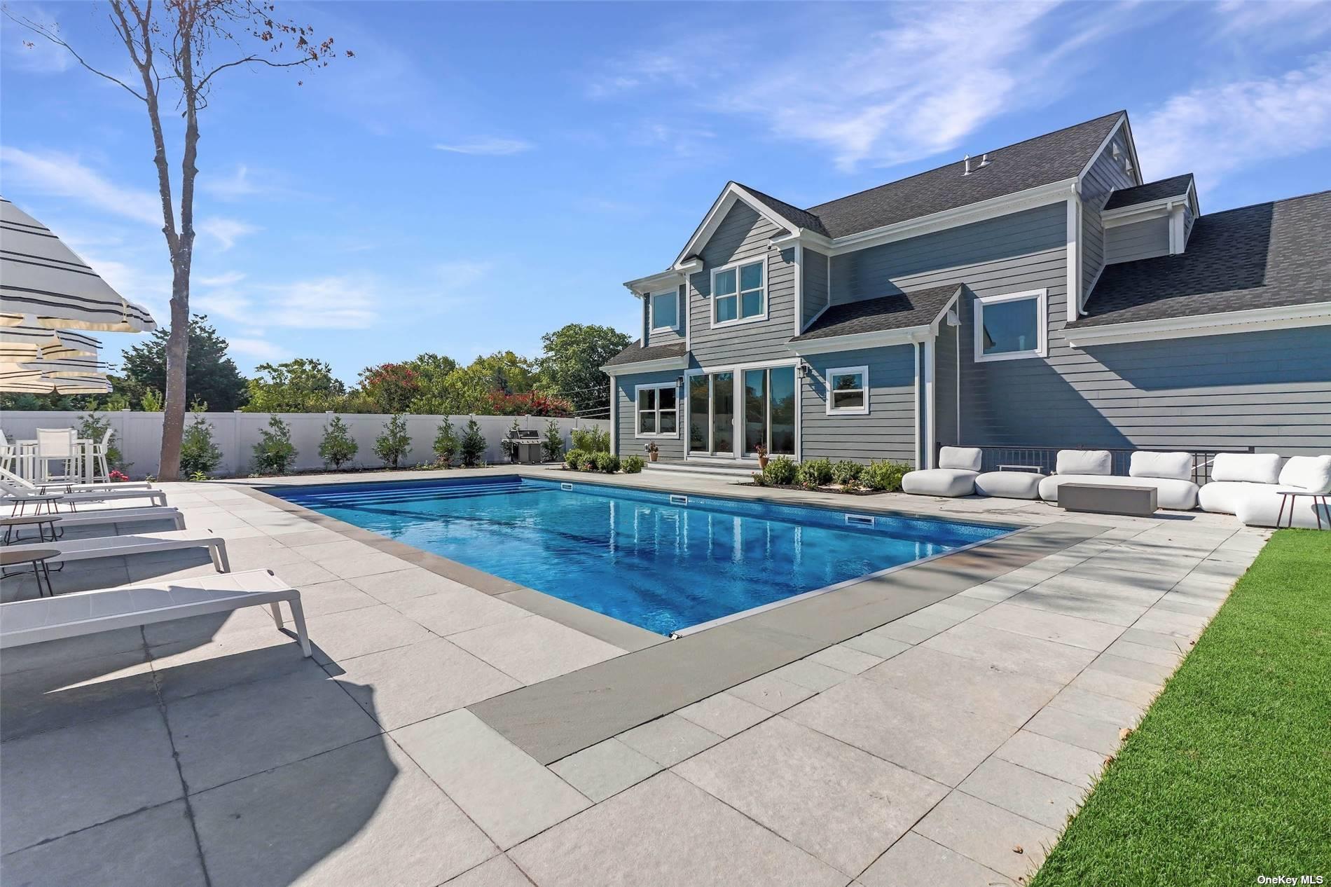 950 Tasker Lane Greenport, NY 11944 - Photo 2 of 37 a view of a house with swimming pool