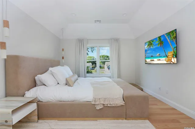 a room with gym equipment and large mirror
