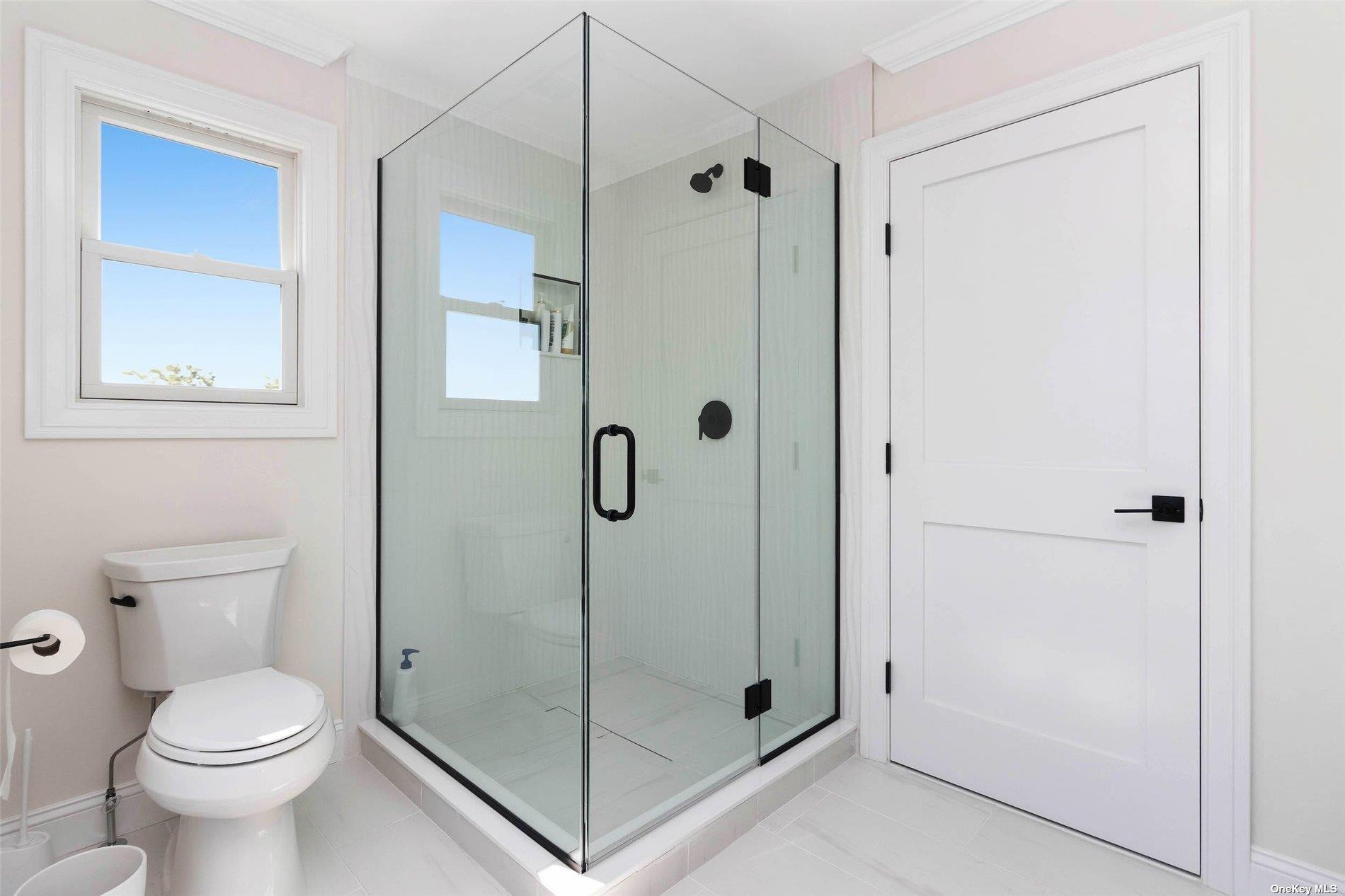 950 Tasker Lane Greenport, NY 11944 - Photo 26 of 37 a bathroom with a shower and toilet