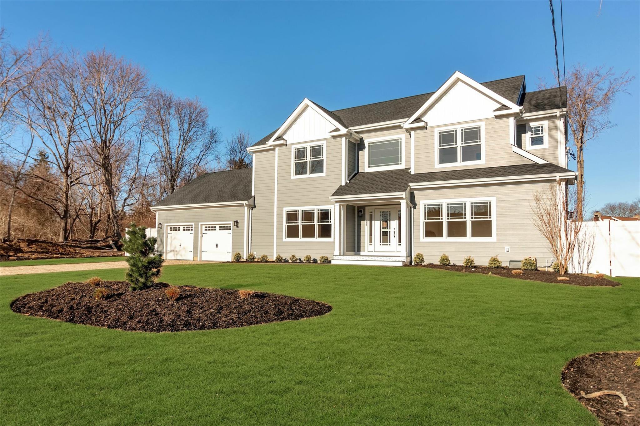 950 Tasker Lane Greenport, NY 11944 - Photo 3 of 37 a front view of a house with a yard
