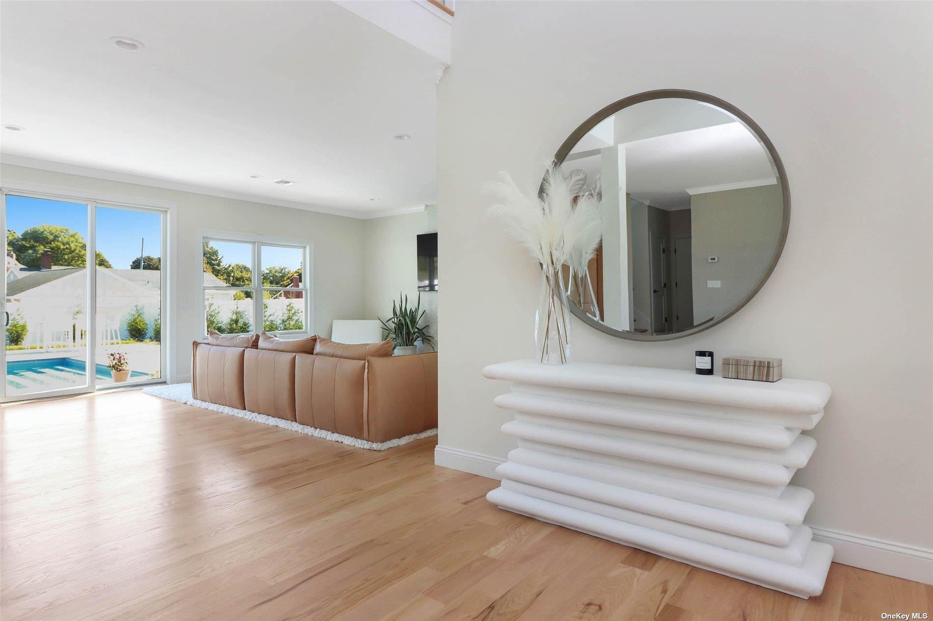 950 Tasker Lane Greenport, NY 11944 - Photo 3 of 37 a living room with furniture and a mirror