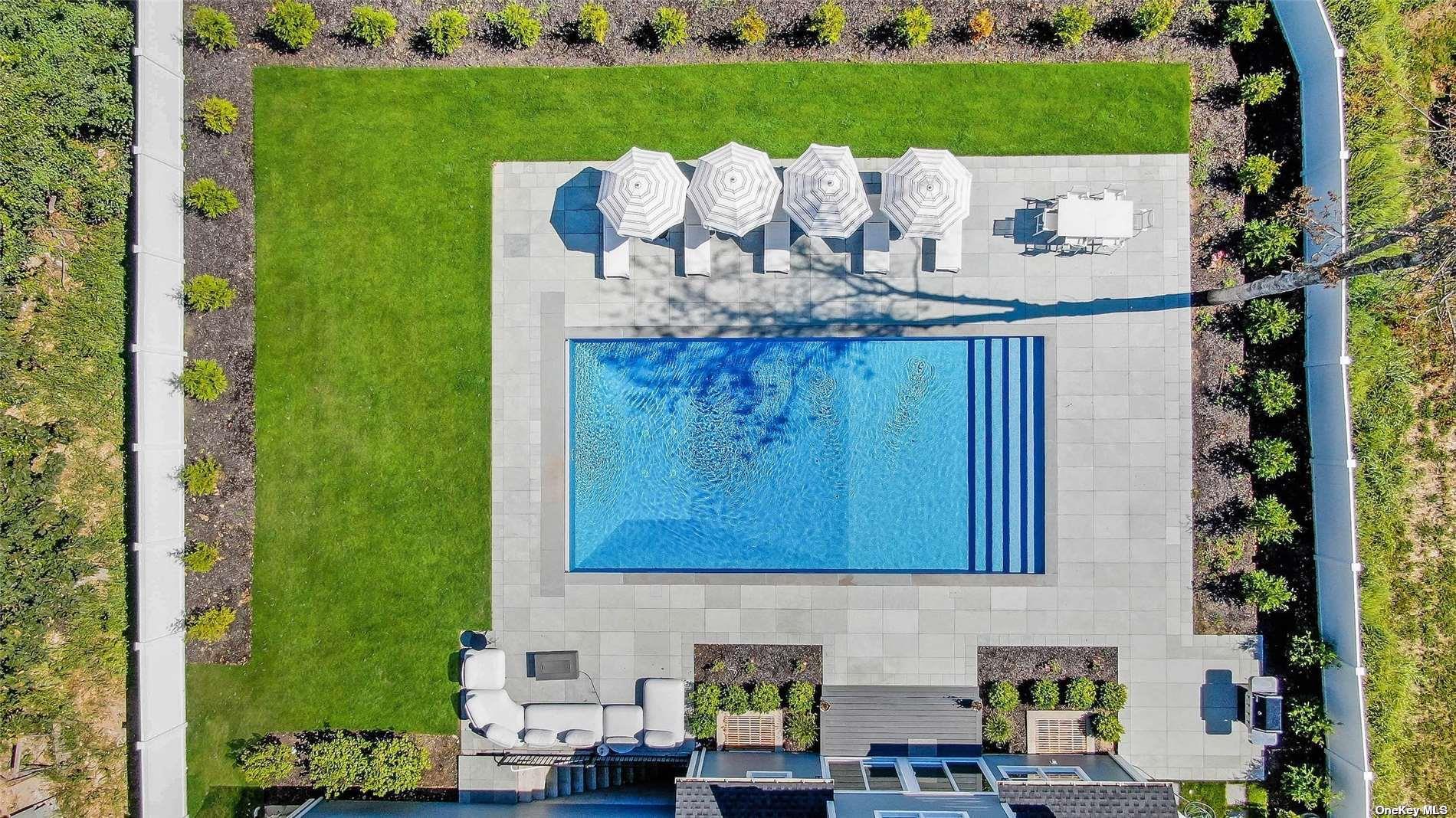 950 Tasker Lane Greenport, NY 11944 - Photo 35 of 37 a view of a table and chairs in the garden