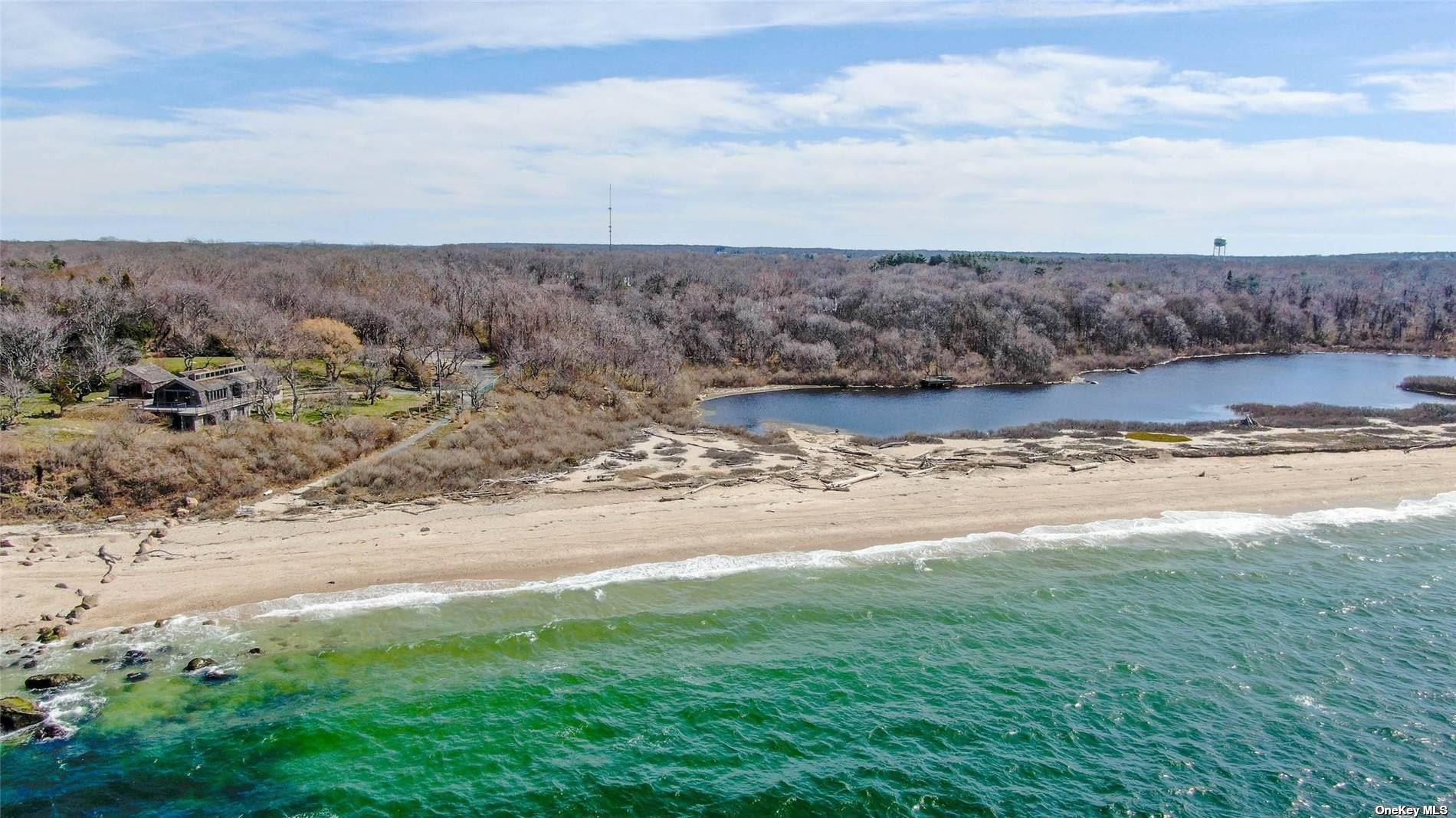 950 Tasker Lane Greenport, NY 11944 - Photo 36 of 37 a view of a dry yard with wooden fence