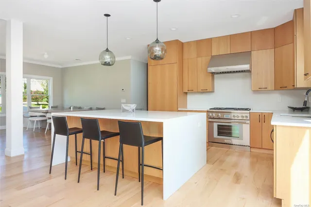 a kitchen with a cabinets and chairs