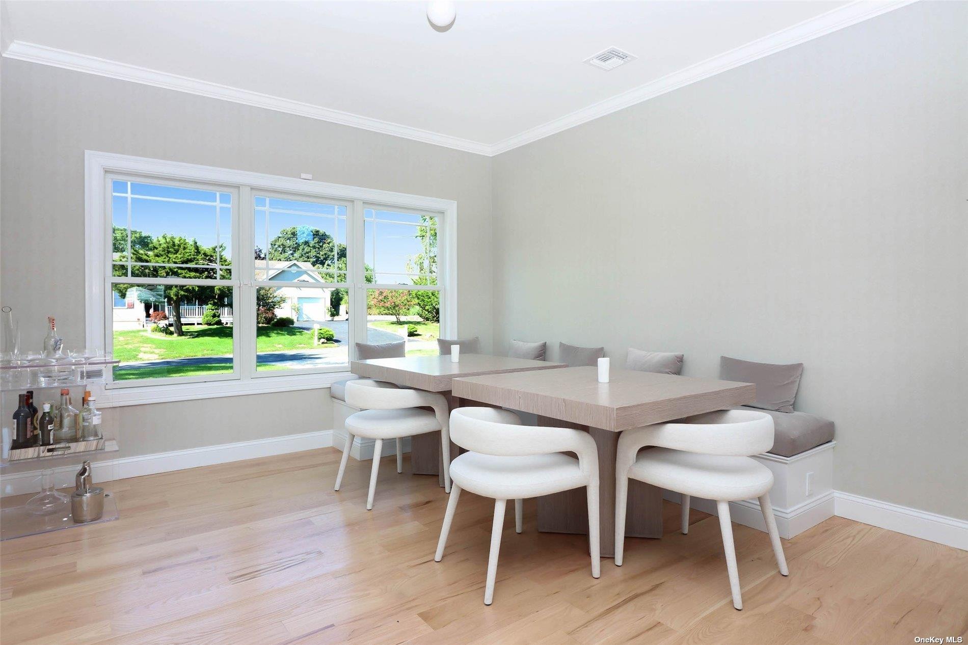 950 Tasker Lane Greenport, NY 11944 - Photo 9 of 37 a view of a dining room with furniture window and outside view