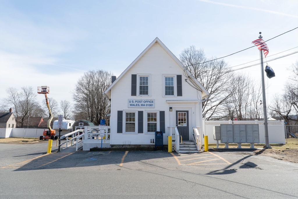 2 Monson Road Wales, MA 01081 - Photo 3 of 23 a palm tree in front of a house