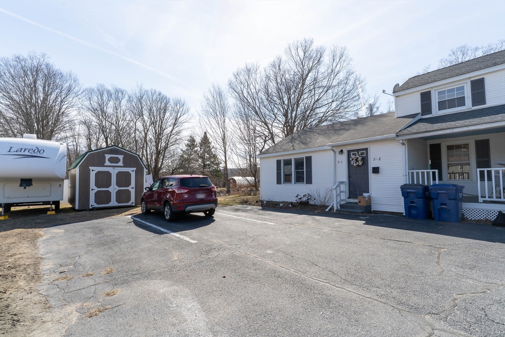 2 Monson Road Wales, MA 01081 - Photo 7 of 23 a car parked in front of house
