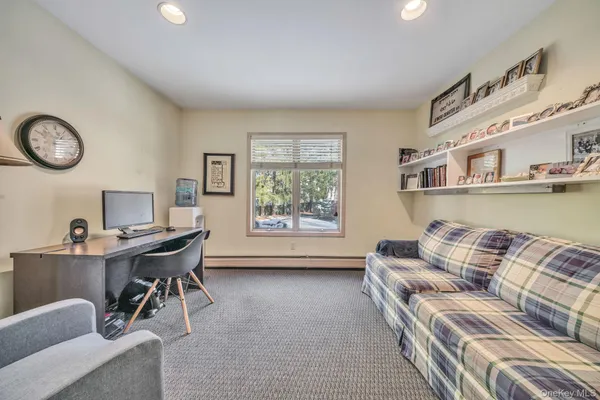 a workspace with furniture and a window