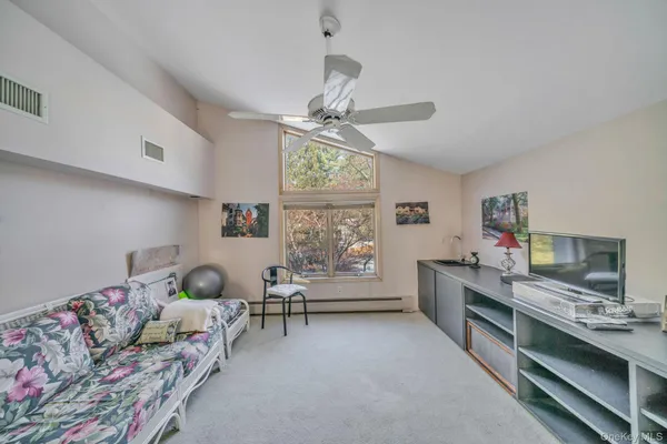 a bedroom with furniture and a window