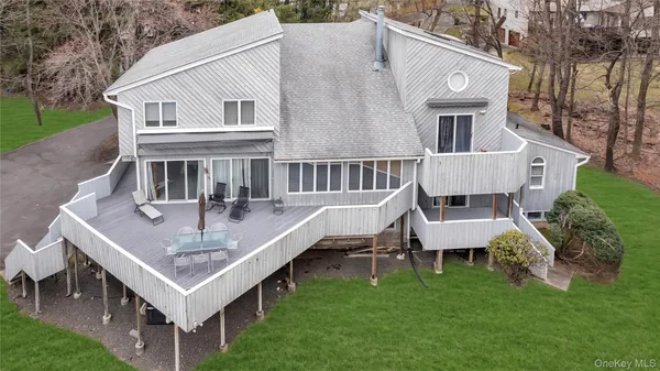 a view of a house with a table and chairs