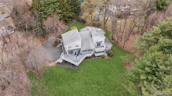 an aerial view of a house with a yard